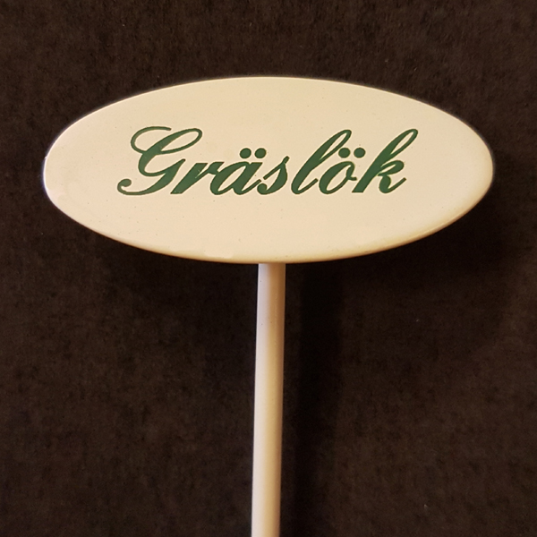 Gräslök skylt liten på spjut